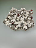 Spessertine and Albite on Muscovite, Tongbei, Fujian Province, China, Mined c. early 2000s, ex. WIlliam Mickols Collection WEM591, Small Cabinet, 1.3 x 6 x 8 cm, $450. Online Oct. 9.