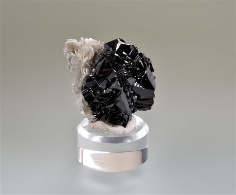 Cassiterite on Muscovite, Pingwu, Sichuan Province, China, Mined c. 1999, Megerle Collection, Miniature 3.5 x 3.5 x 4.5 cm, $450. Online 3/9