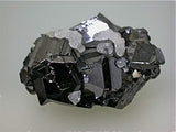 SOLD Calcite on Sphalerite, Trepca Complex, Municipality Kosovska, Kosovo, Mined 2010-2012, Minaiture 1.8 x 2.7 x .4.0 cm, $25.  Online 7/02