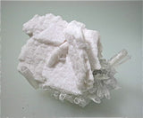 SOLD Manganoan Calcite on Quartz, Kruchev dol Mine, Madan District, Smolyan Oblast, Bulgaria, Mined 2013, Small Cabinet 5.0 x 6.5 x 9.5 cm, $250.  Online 8/27